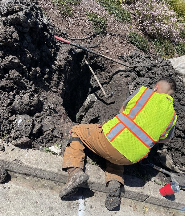 Plumber repairing a burst pipe and water leak in a residential home | Burst Pipe & Water Leak Repair
