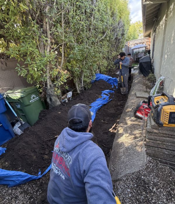 Plumber performing trenchless pipe repair with minimal excavation | Trenchless Pipe Repair