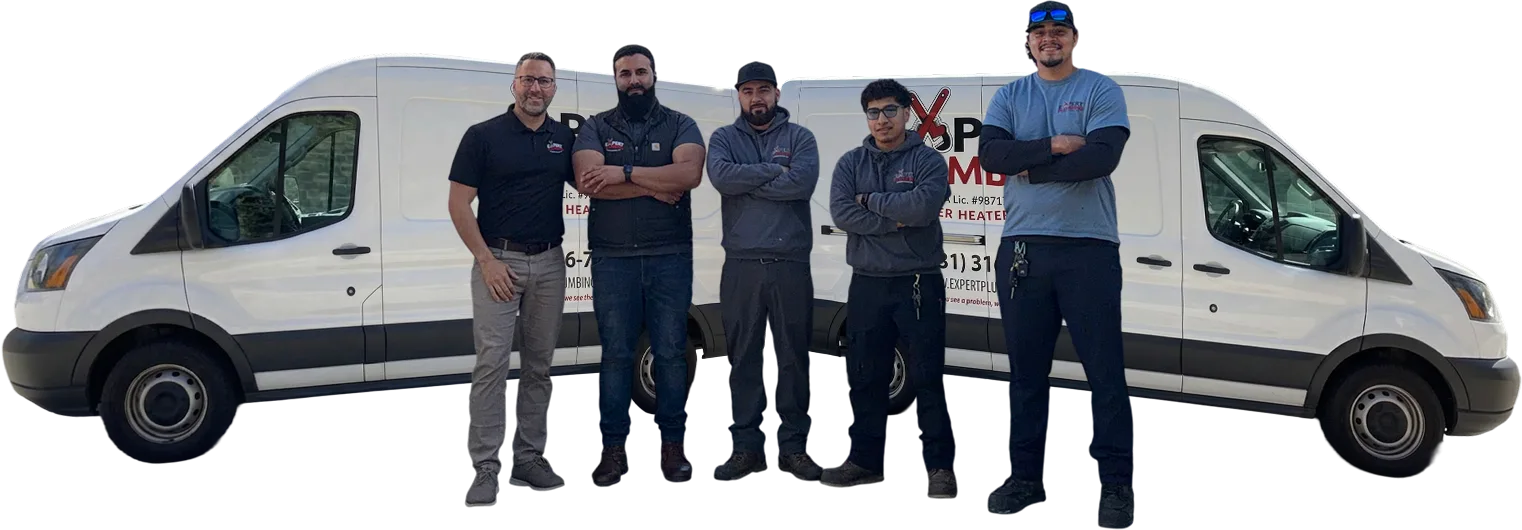 Five Expert Plumbing & Water Heaters plumbers stand in front of branded service vans wearing company uniforms.
